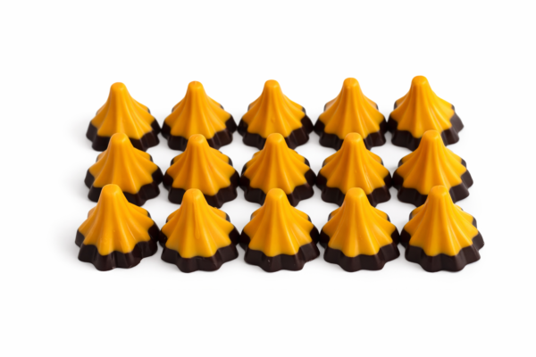 Bell-shaped chocolates on white backdrop Bell-shaped chocolates on white backdrop