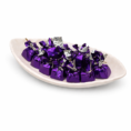 Ceramic dish with purple wrapped chocolates
