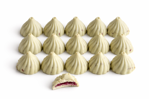 Pistachio-white chocolate modaks with raspberry filling Pistachio-white chocolate modaks with raspberry filling